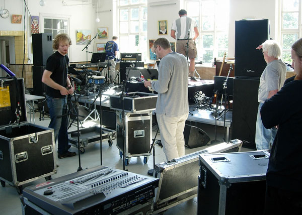 The two men in this picture who appear to be urinating are not urinating