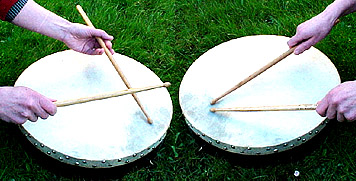 Linda demonstrates two grips using BJ's sticks ... on a bodhran !
