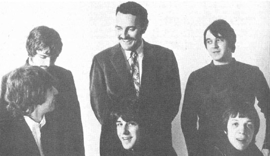 Thanks to Matthew Fisher for identifying the Sixth Man here as Jerry Moss, the 'M' of 'A&M'