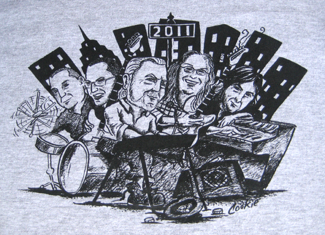 ' ... the cartoon shirt should shurely be rejected as it appears to depict the Peggster brandishing a mere four-string bass.  Sacrilege, I say'